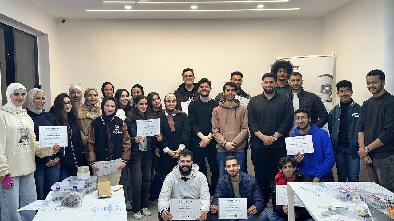MCC students holding their certificates at the end of a course