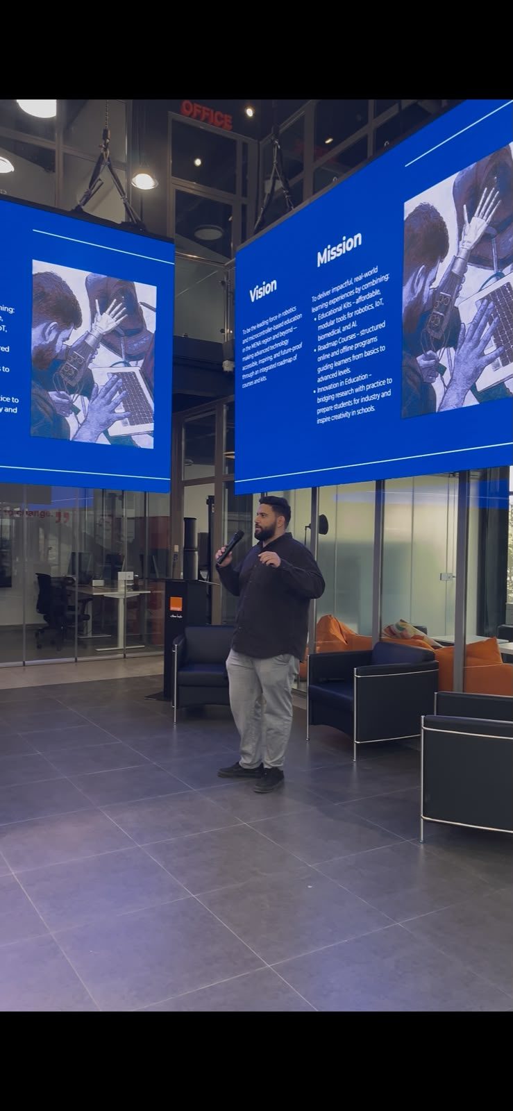 An MCC founder presenting the company's vision and mission on stage