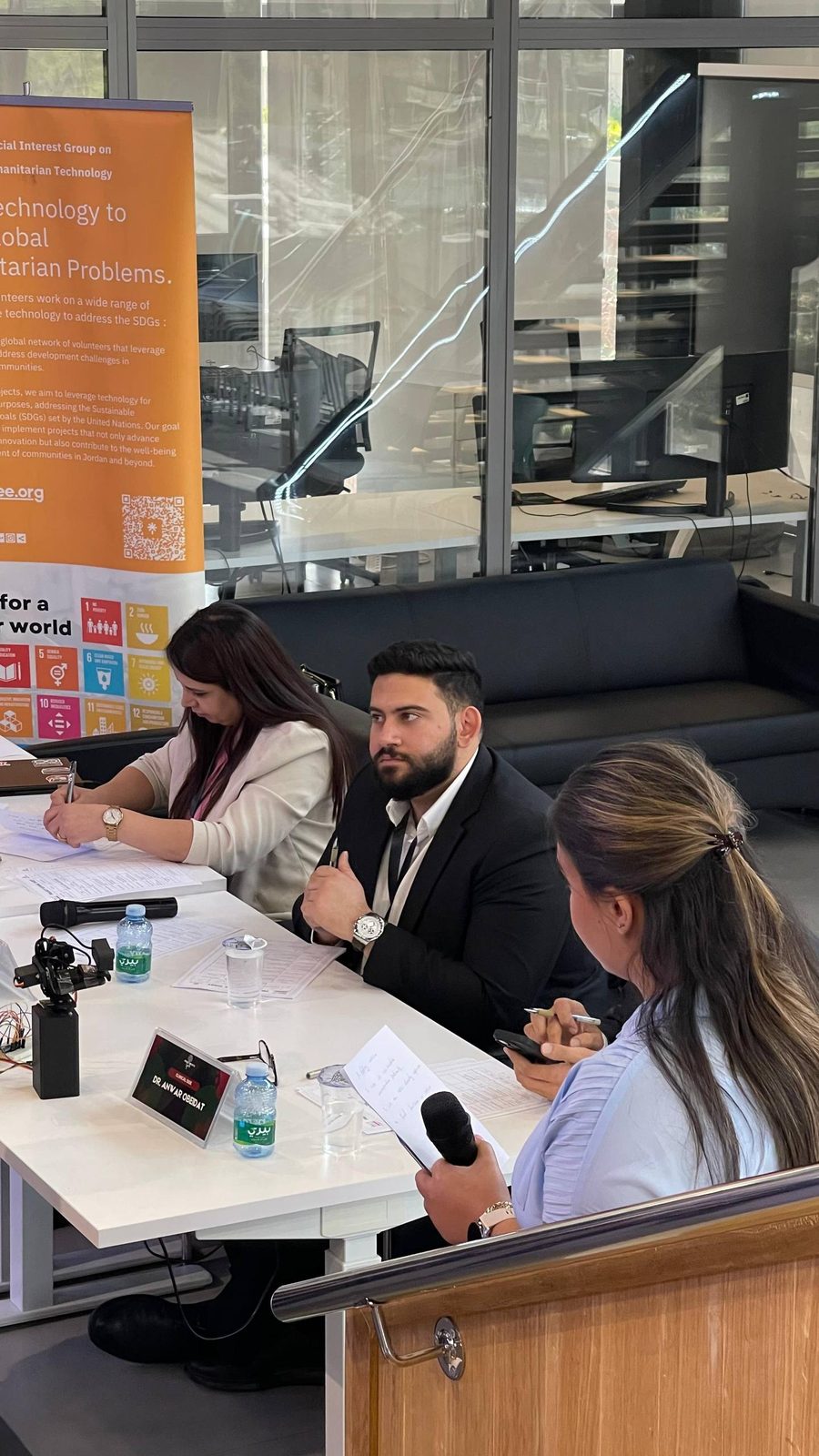 MCC team members serving on a judging panel at an IEEE Humanitarian Technologies event